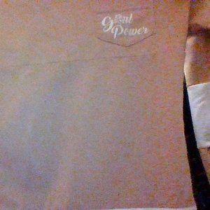 A Girl Power shirt with flowers on sleeves